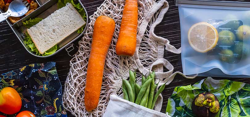 fruits and vegetables in reusable bags